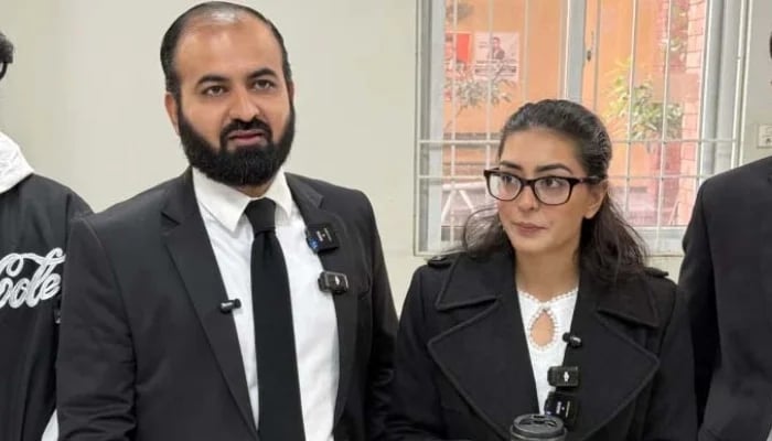 Human rights lawyer Imaan Mazari (right) with her husband and fellow lawyer Hadi Ali Chattha, during a court hearing in Islamabad on December 5, 2025. — AFP