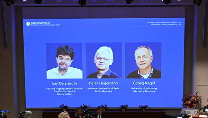 Left to right — US scientist Karl Deisseroth, German scientists Peter Hegemann and Georg Nagel . — AFP