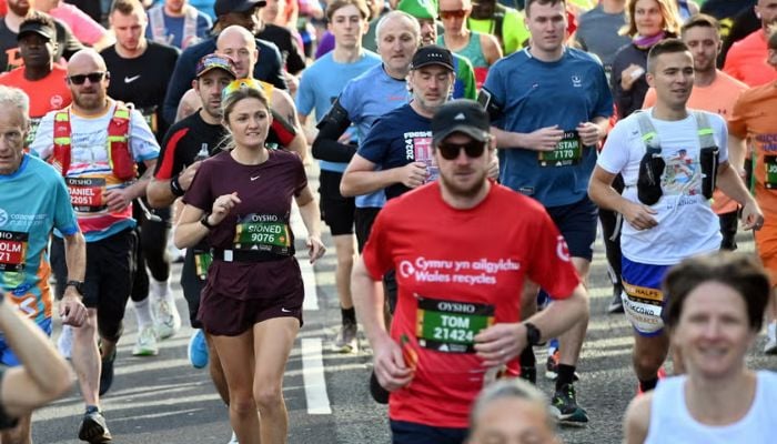 Participants of Cardiff Half Marathon running through the route