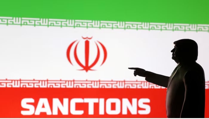A 3D-printed miniature model depicting U.S. President Donald Trump, the Iranian flag and the word Sanctions in this illustration, created on April 17, 2025.— Reuters