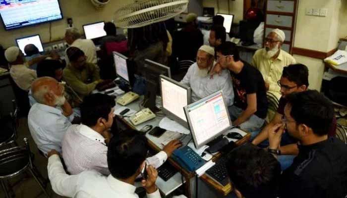 Employees working in an office. — AFP/File
