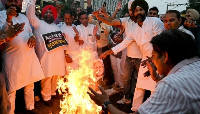 Indian men protesting against Indian election commission. — AFP