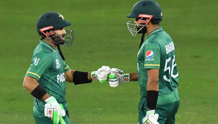 Pakistan captain Babar Azam (right) and wicketkeeper-batter Muhammad Rizwan bump fists during a match. — X/ @WisdenCricket/File