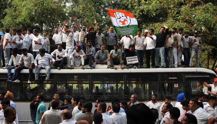 Demonstrators on a bus take part in a protest organised by opposition parties demanding the resignation of Chief Election Commissioner Gyanesh Kumar, in New Delhi, India, October 8, 2026
