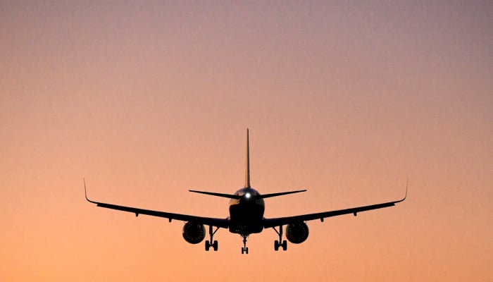 A passenger aircraft descends to land at Heathrow Airport in London, Britain, January 5, 2022. — Reuters