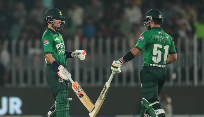 Pakistan’s Sahibzada Farhan (right) and Maaz Sadaqat exchange a high-five during the first T20I against Sri Lanka at Rawalpindi Cricket Stadium on October 9, 2026. — PCB