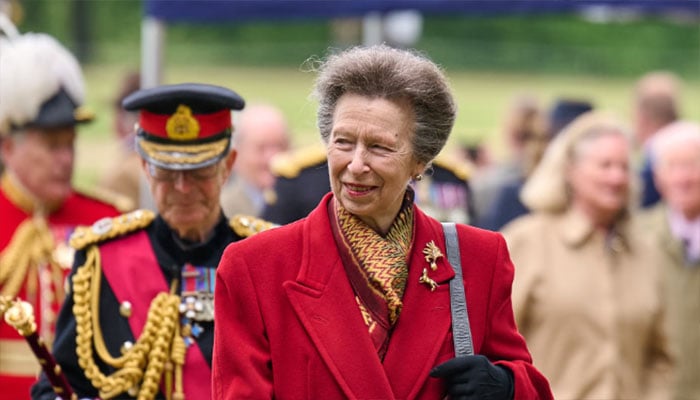 Princess Anne serves up a red-hot look for sports injury conference