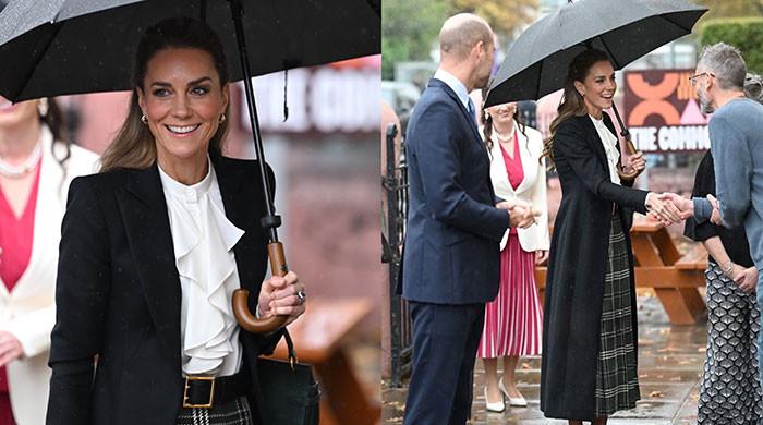 Prince William and Kate weather the storm as they arrive in Belfast