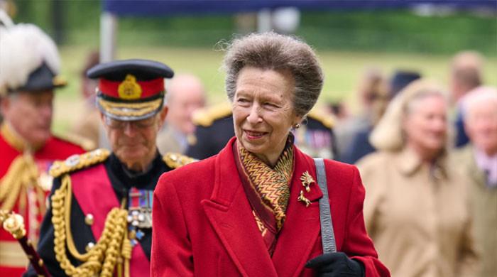 Princess Anne serves up a red-hot look for sports injury conference