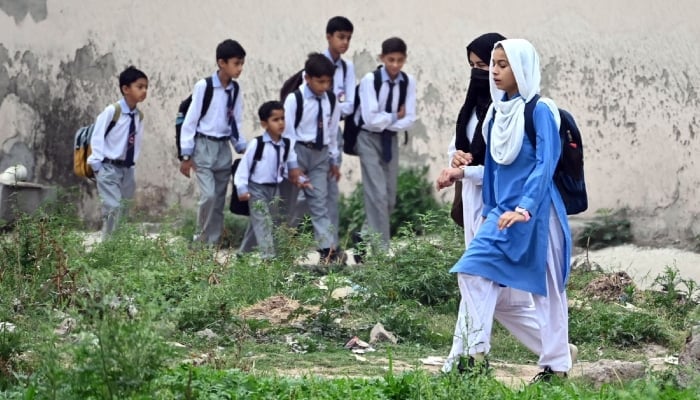 Students can be seen on their way to school as educational institutions reopen after a one-day closure due to Indian airstrikes in Islamabad on May 8, 2025. — APP