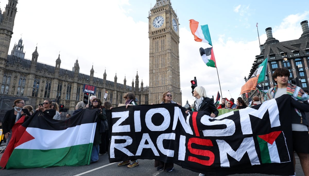 People attend a pro-Palestinian protest march through the city to mark the third anniversary of the war in Gaza, in London, Britain, October 10, 2026. REUTERS