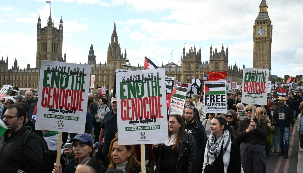 People cross Westminster Bridge as they take part in a National March in support of Palestine, organised by Palestine Solidarity Campaign, in central London on October 10, 2026. — AFP