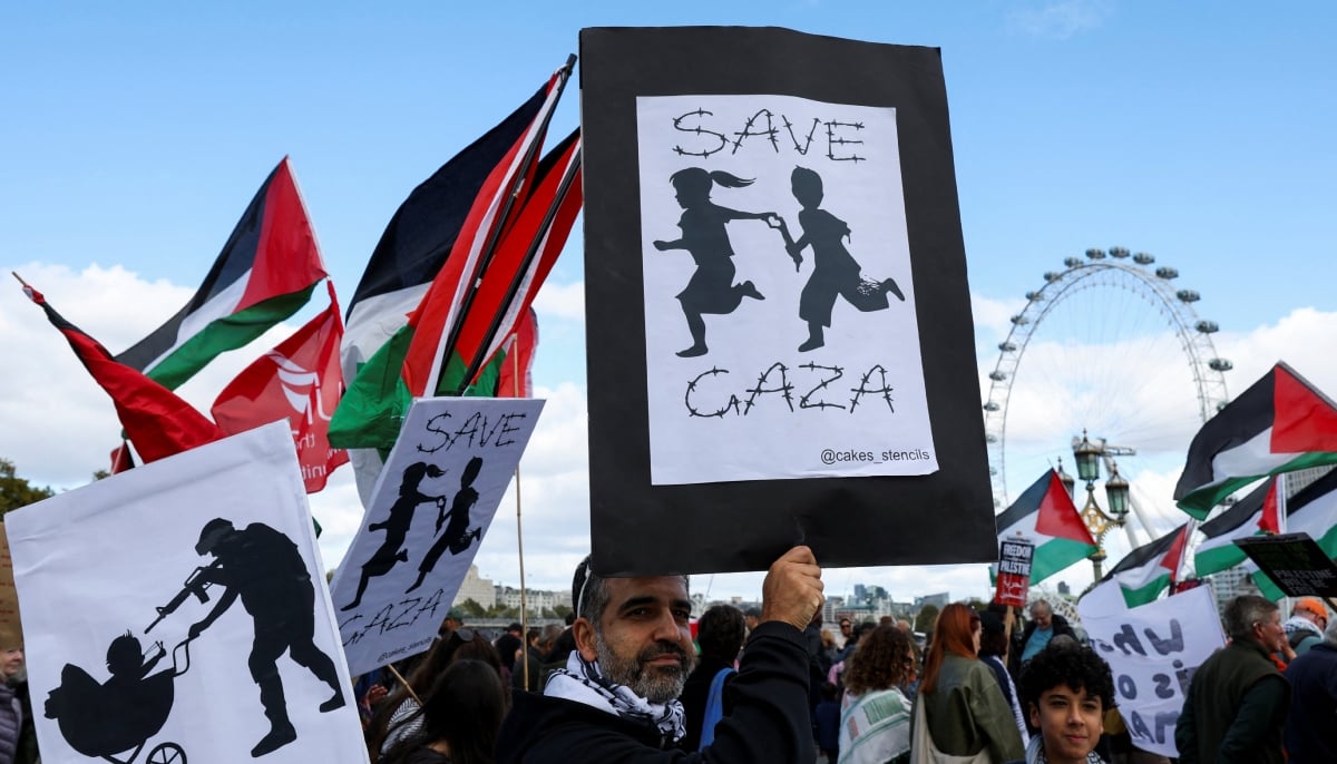 People attend a pro-Palestinian protest march through the city to mark the third anniversary of the war in Gaza, in London, Britain, October 10, 2026. — Reuters