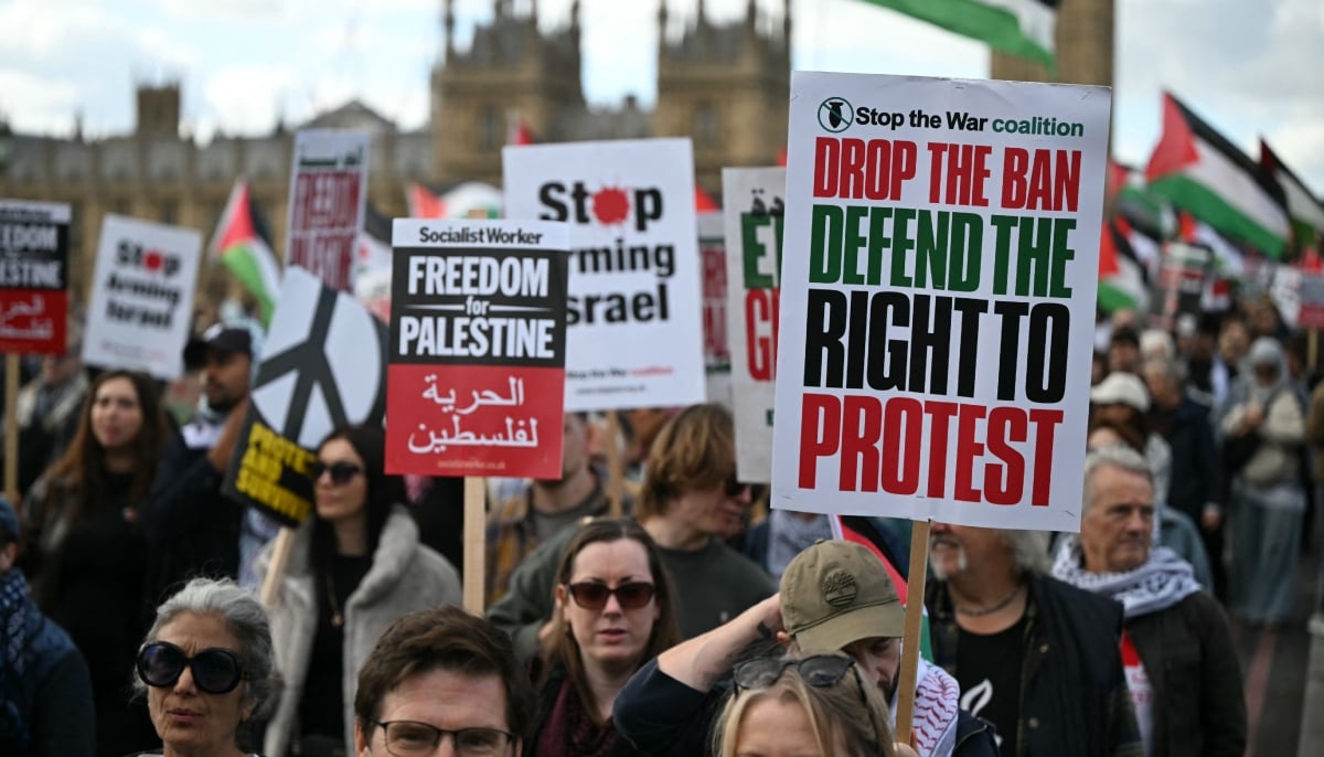 People cross Westminster Bridge as they take part in a National March in support of Palestine, organised by Palestine Solidarity Campaign, in central London on October 10, 2026. — AFP