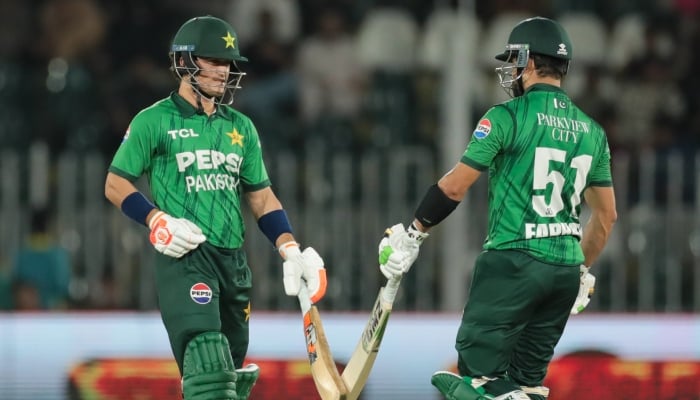 Pakistans Maaz Sadaqat (left) and Sahibzada Farhan bump their bats during their second T20I against Sri Lanka at the Rawalpindi Cricket Stadium in Rawalpindi on October 11, 2026. — PCB
