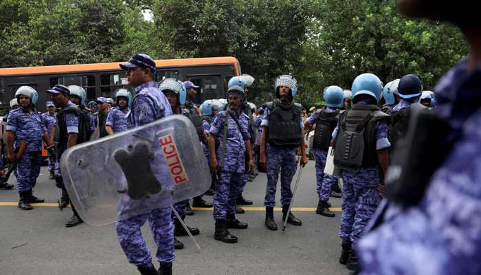 Rapid Action Force (RAF) personnel stand guard amid protests demanding the resignation of Indias Chief Election Commissioner, Gyanesh Kumar, in New Delhi, India, on October 11, 2026. — Reuters