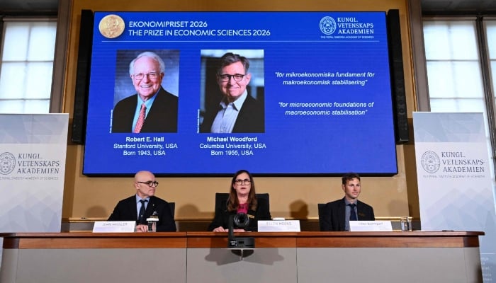 Secretary General of the Royal Swedish Academy of Sciences Ellen Moons (centre), Chair of the Prize Committee John Hassler (left) and Member of the Prize Committee and expert Timo Boppart announce US macroeconomists Robert E Hall and Michael Woodford as the winners of the 2026 Sveriges Riksbank Prize in Economic Sciences at the Royal Swedish Academy of Sciences in Stockholm, October 12, 2026. — AFP