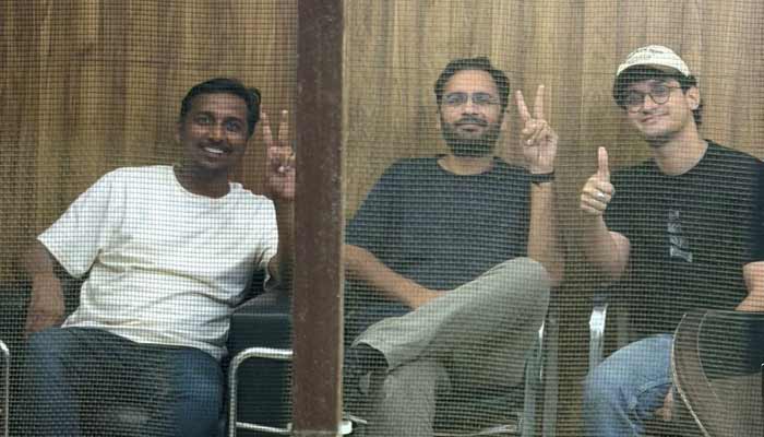 Saurav Das, chief spokesperson of the Cockroach Janta Party (CJP), Ashutosh Ranka, co-convenor of CJP, and Ajinkya Shinde pose for a picture from what the party says is inside the Parliament Street Police Station at a location given as New Delhi, India. — Reuters