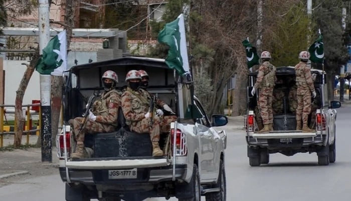 Security personnel patrol with vehicles on a street in Quetta, Balochistan. — AFP/File