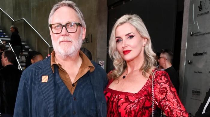 Vic Reeves joins wife Nancy Sorrell on the pink carpet after hospital dash