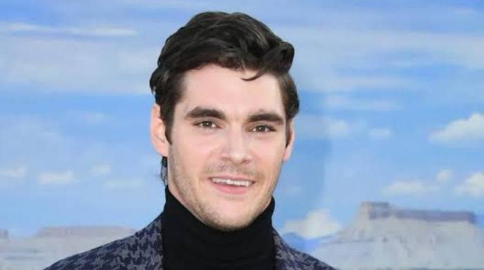 RJ Mitte's ex Saint Sasha says she 'can't believe this is real' as she mourns actor