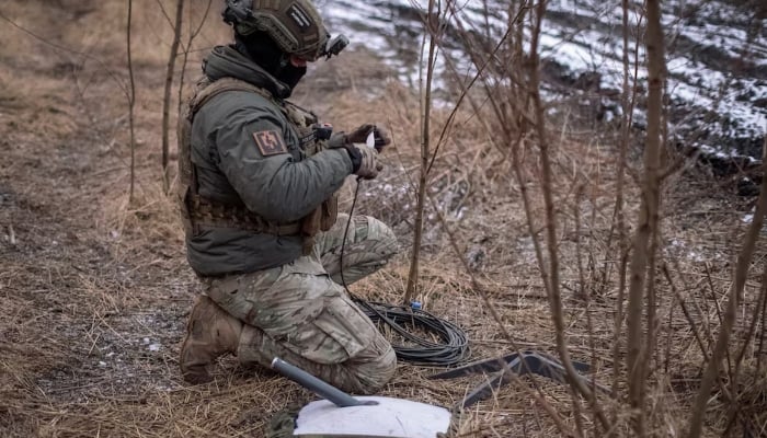 A Ukrainian serviceman of 47th brigade prepares a Starlink satellite internet systems at his positions at a front line, amid Russias attack on Ukraine, near the town of Avdiivka, recently captured by Russian troops in Donetsk region, Ukraine February 20, 2024. — Reuters