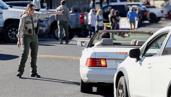 Emergency personnel direct traffic at the Journey Church family reunification location following a shooting at Silver Rail Elementary School in Bend, Oregon, on October 15, 2026. — Reuters