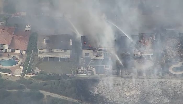 Santa Ana winds spark brush fires, triggering evacuations across Southern California