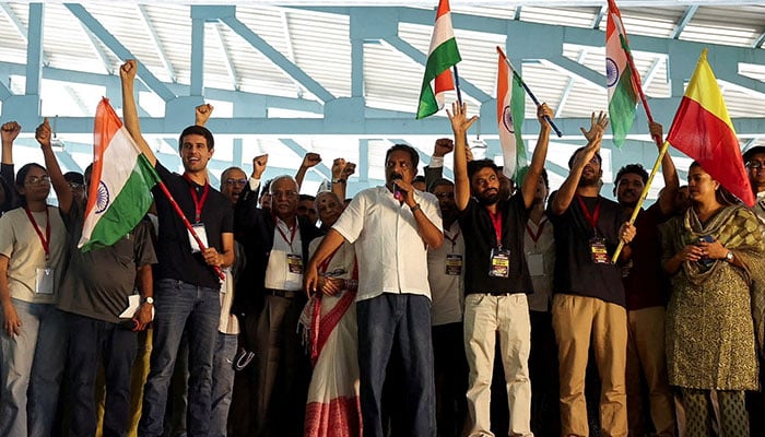 Indian social media influencer and activist Dhruv Rathee, Indian actor Prakash Raj, Cockroach Janta Party founder Abhijeet Dipke and other supporters gesture during a protest demanding the resignation of the countrys election chief Gyanesh Kumar, in Bengaluru, India, October 8, 2026. — Reuters