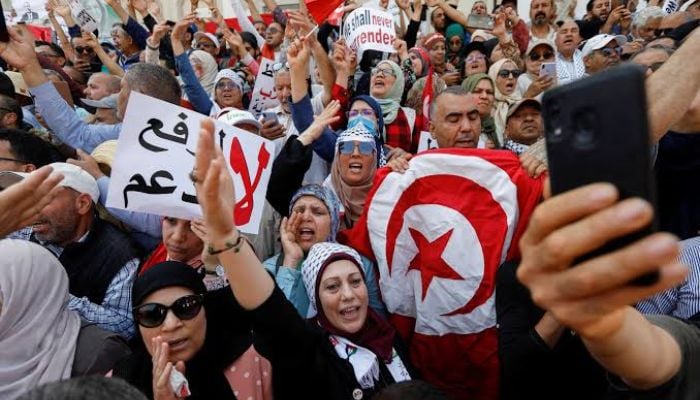 Arab Spring slogans return to Tunisia as thousands demand presidents removal