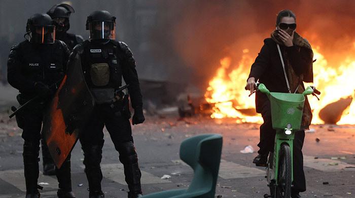 French police clash with protesters as tens of thousands rally over cost of living