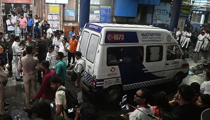 An ambulance carrying victims after a stampede during a Hindu religious event in Kolkata, India, on Oc. — AFP