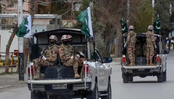 Security personnel patrol with vehicles on a street in Quetta, Balochistan. — AFP/File