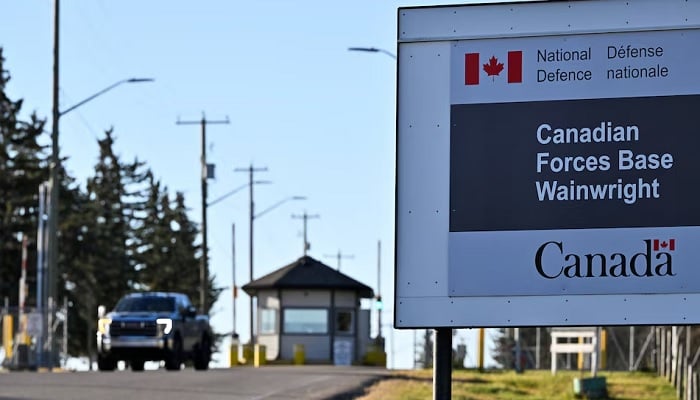 A sign for Canadian Forces Base (CFB) Wainwright, the day after a serious incident that resulted in a fire that caused deaths and injuries, in Wainwright, Alberta, Canada, on October 18, 2026. — Reuters