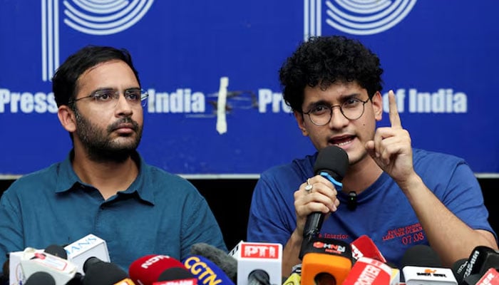 Saurav Das, chief spokesperson of the Cockroach Janta Party (CJP), speaks next to Ashutosh Ranka, co-convenner of CJP, during a press conference at the Press Club of India following their release, amid protests demanding the resignation of Indias Chief Election Commissioner Gyanesh Kumar, in New Delhi, India, October 11, 2026. — Reuters