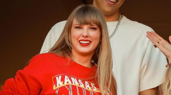 Taylor Swift makes surprise appearance for Travis Kelce after Academy Gala