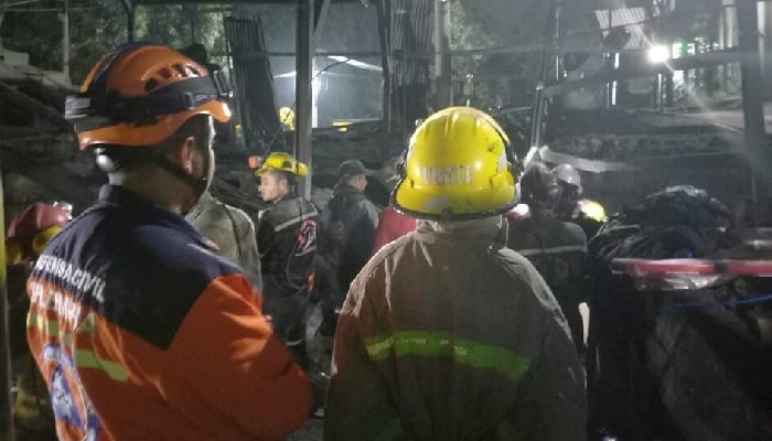 Volunteers from the Colombian Civil Defence, in coordination with relief agencies, engage in the search and rescue work of miners trapped following the explosion of a mine in Sutatausa, Colombia, in this handout image released on March 15, 2023. — Reuters