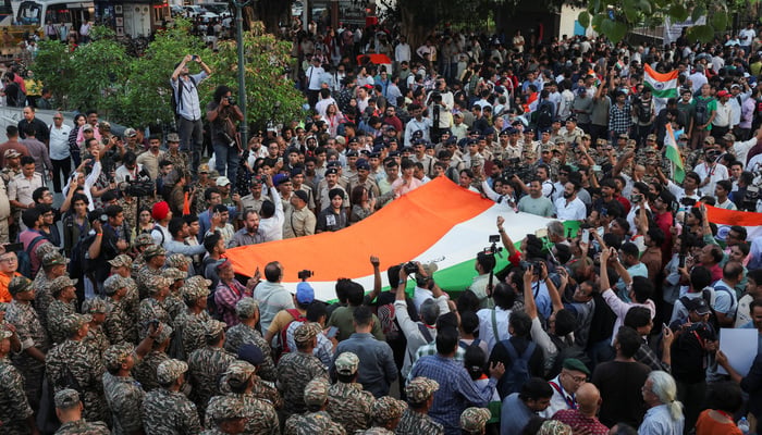 Protestors amid security personnels chant slogans as they take part in a flag rally by the Cockroach Janta Party (CJP) seeking the resignation of Indias Chief Election Commissioner Gyanesh Kumar, in New Delhi, India, October 16, 2026. — Reuters