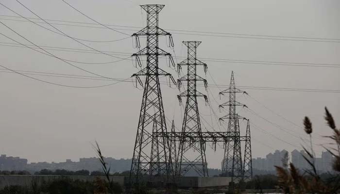 A power transmission tower is seen a day after a countrywide power breakdown in Karachi, Pakistan, on January 24, 2023. — Reuters