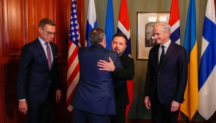 Ukrainian President Volodymyr Zelenskiy hugs US Special Envoy Steve Witkoff next to Norwegian Prime Minister Jonas Gahr Store and Finnish President Alexander Stubb in Oslo, Norway, October 20, 2026. — Reuters