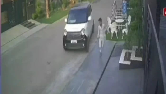 The boy is seen running before the car strikes him down. — Screengrab via Geo News