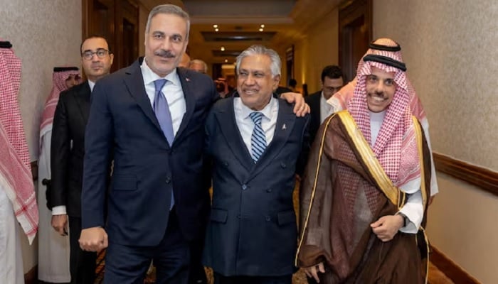 Turkiyes Foreign Minister Hakan Fidan, Pakistans Deputy Prime Minister and Foreign Minister Mohammad Ishaq Dar and Saudi Arabias Foreign Minister Prince Faisal bin Farhan Al Saud leave after a committee meeting of Makkah defence pact in Riyadh, Saudi Arabia, on October 5, 2026. — Reuters