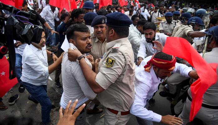 Police personnel scuffle with protesters who crossed the barricades during a protest by the All India Students Association (AISA) demanding the resignation of Indias Chief Election Commissioner, Gyanesh Kumar, in Patna, India, October 13, 2026. — Reuters
