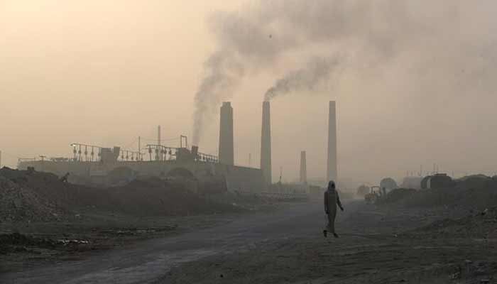 A general view shows brick factories as smoke rises from the stacks in the town of Nahrawan in Baghdad, Iraq. — Reuters