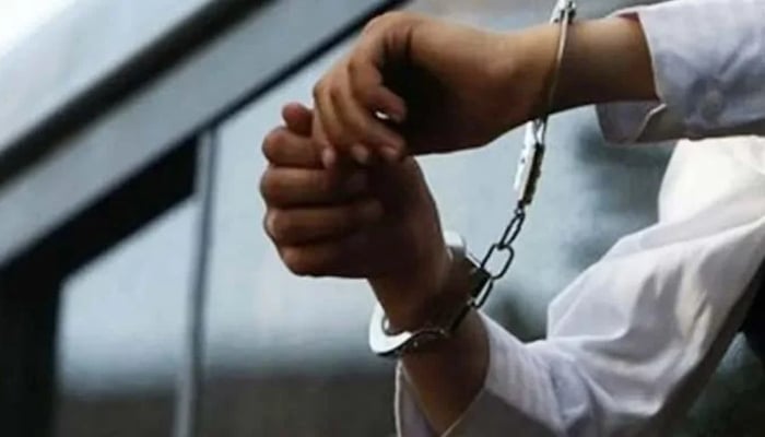 This undated image shows a pair of hands in handcuffs. — Reuters