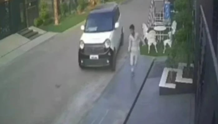 The boy is seen running moments before being fatally run over by a car. — Screengrab via YouTube/Geo News