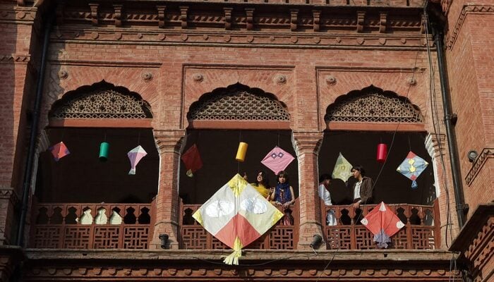 People stand with kites on display to mark Basant, a kite-flying festival, in Lahore, Pakistan February 6, 2026. — Reuters