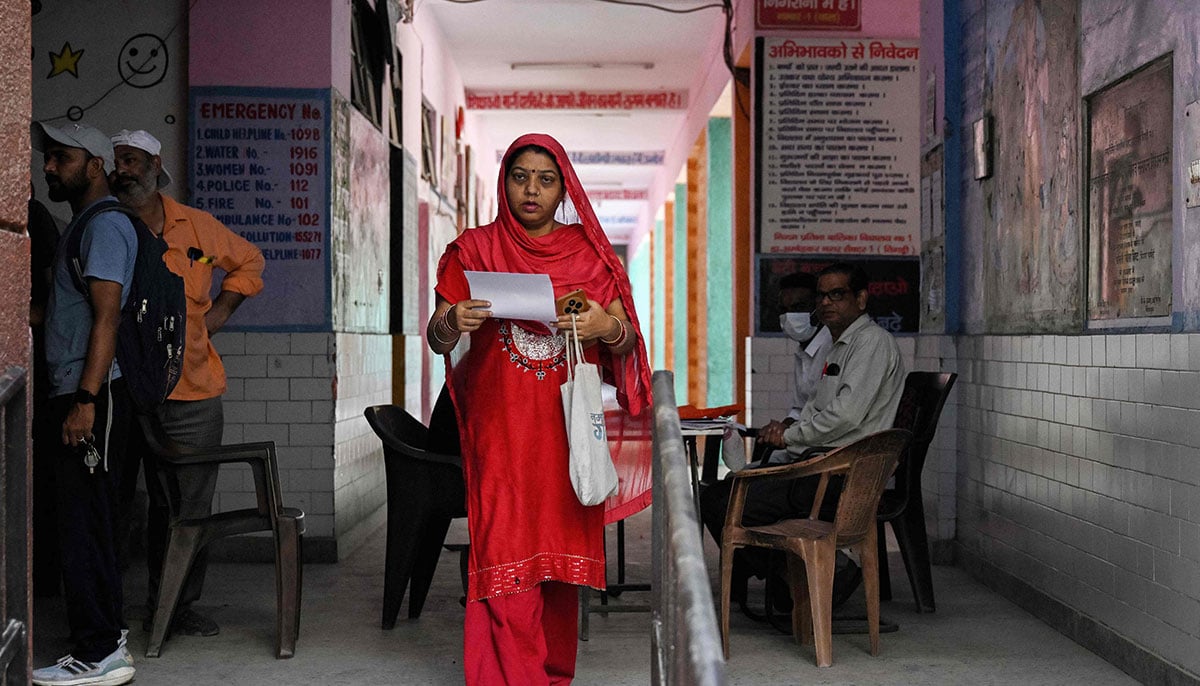 Indians struggle to prove voting eligibility amid voter roll revision 20 A woman leaves after submitting documents to register for the Draft Electoral Roll 2026 as part of the Election Commission of Indias Special Intensive Revision (SIR), at a voter verification camp in New Delhi on October 18, 2026. — AFP
