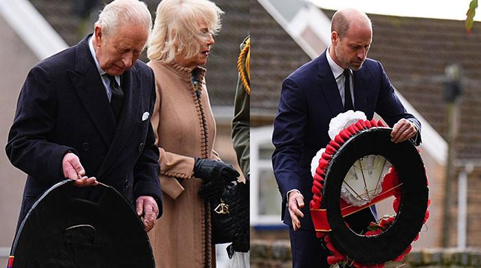 King Charles and William share warm smiles before laying wreaths at Aberfan