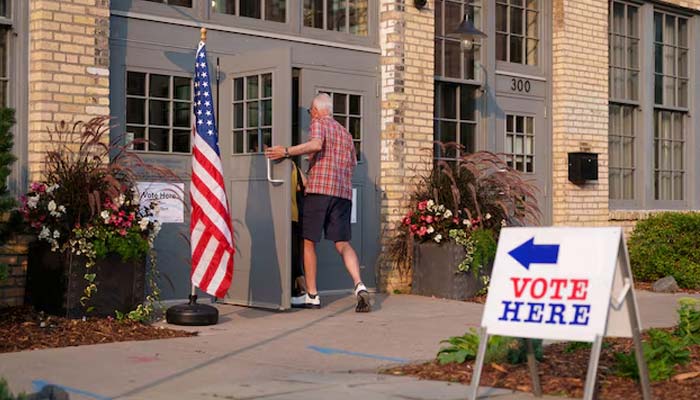 People make their way into a voting site on primary election day in Minneapolis, Minnesota, U.S., August 11, 2026. — Reuters